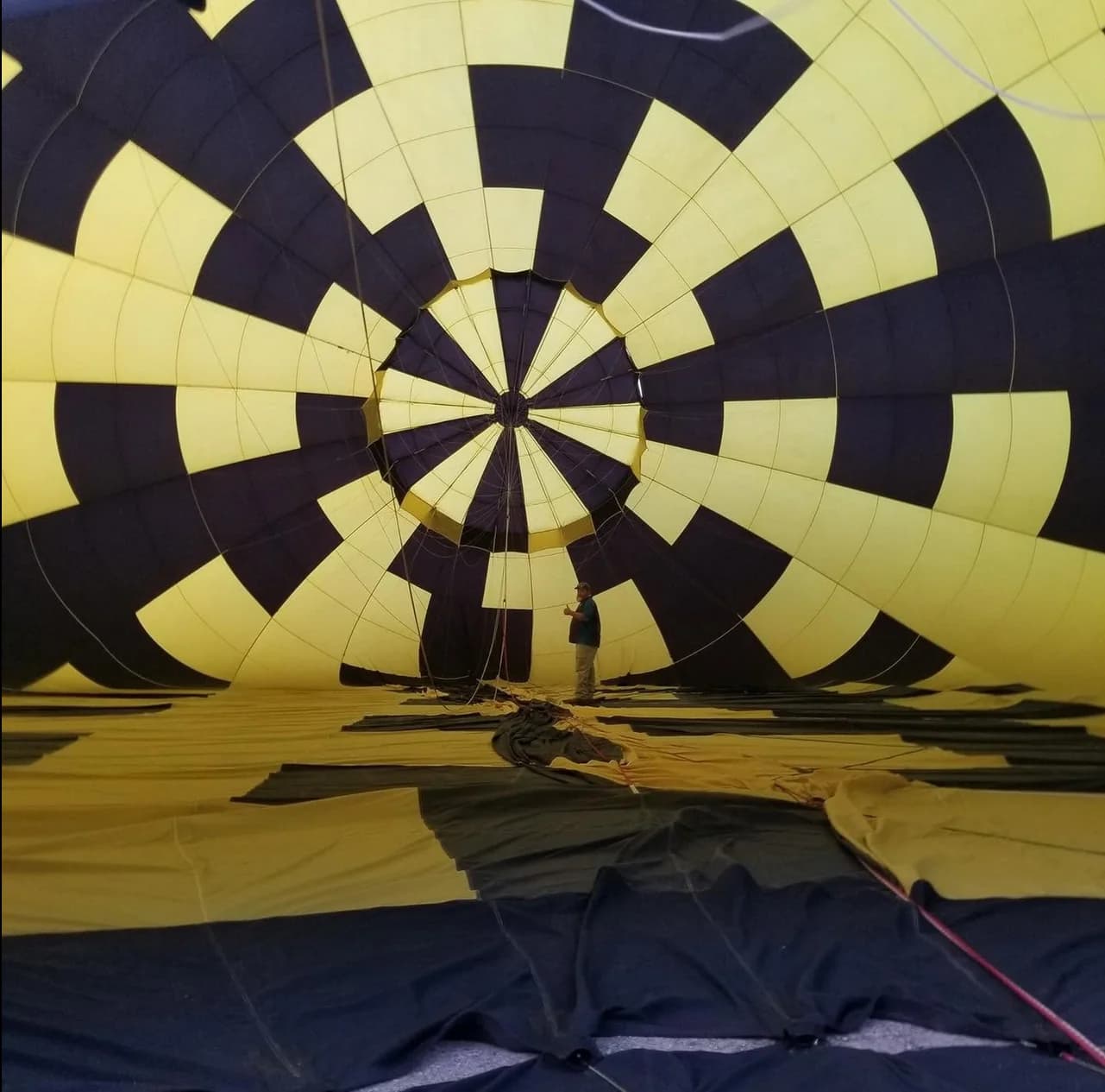 Inside a hot-air balloon envelope with yellow and navy fabric panels